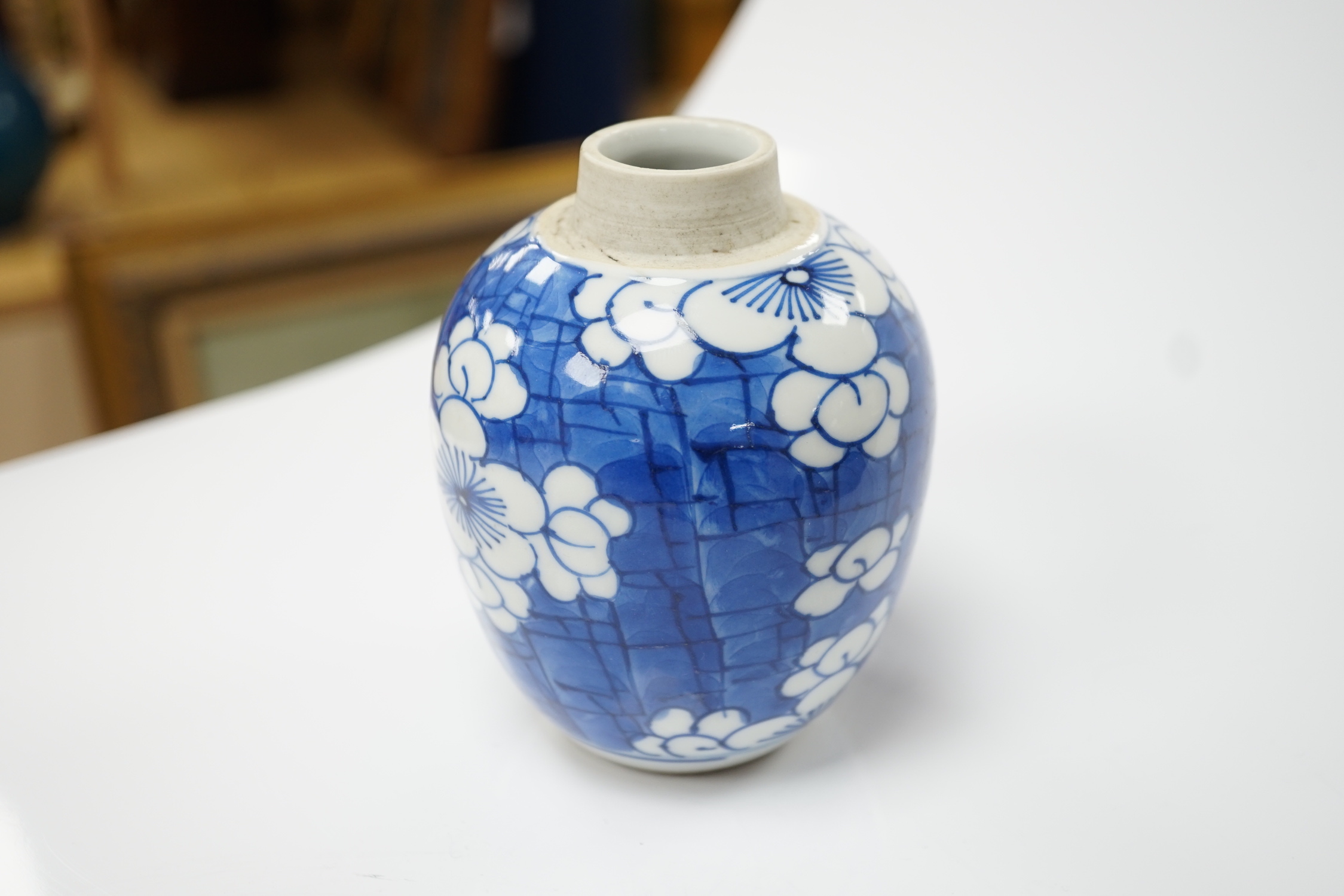 A Chinese Kangxi blue and white ‘prunus’ ovoid jar, 11cm